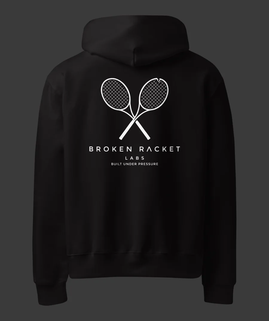 The Lab Coat in black, back view with the white Broken Racket Labs lockup